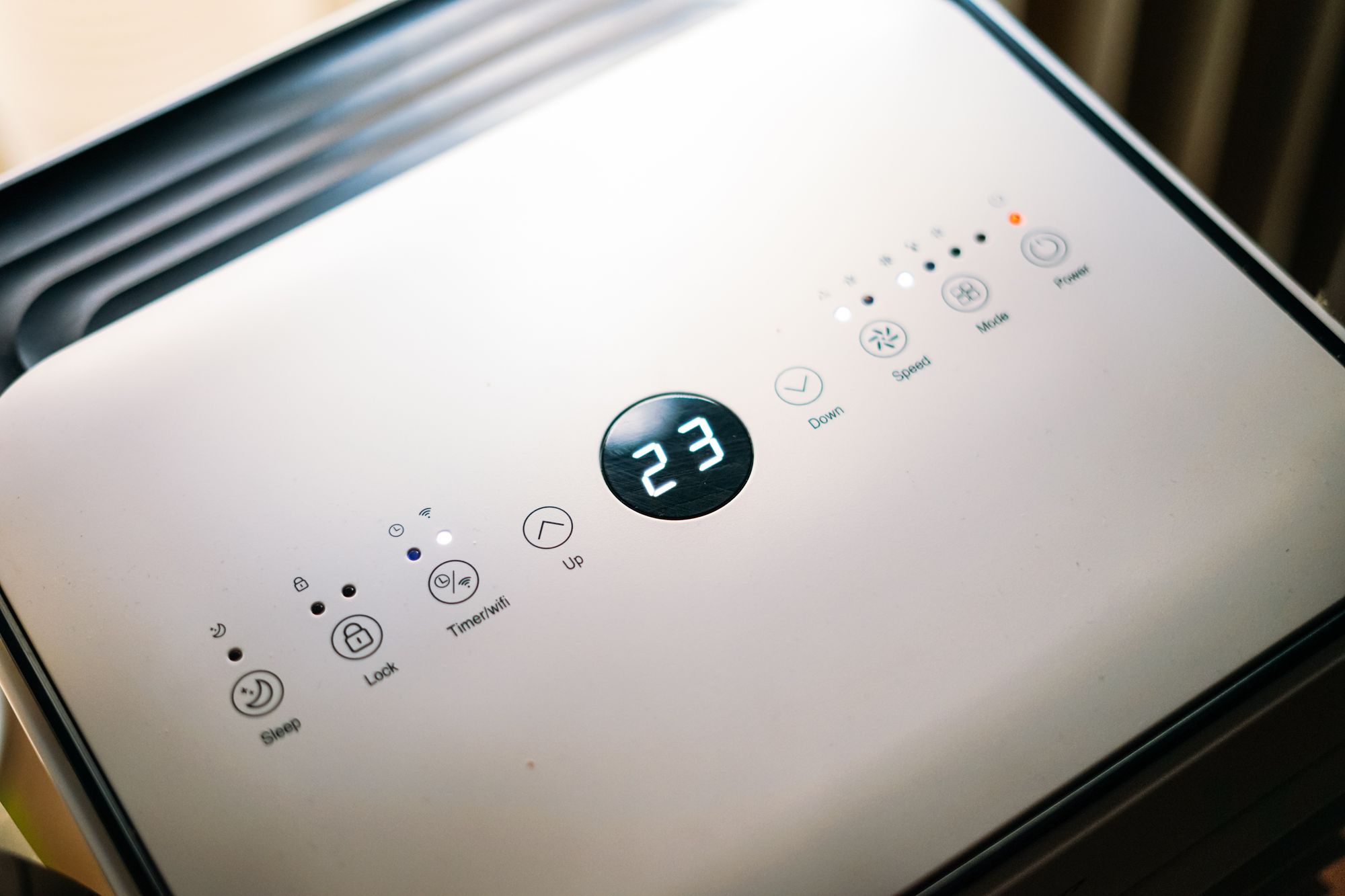 Portable air conditioner top control panel: digital thermostat, timer, sleep, fan speed and mode controls